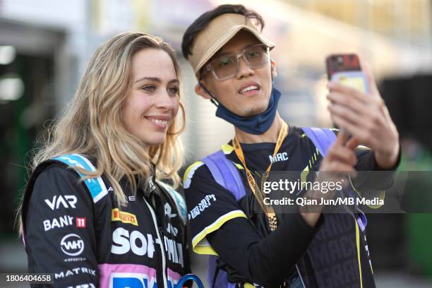 Sophia Florsch of Germany and VAN AMERSFOORT RACING and a fan during the Formula 3 Macau Grand Prix FIA F3 World Cup as part of the 70th Macau Grand...