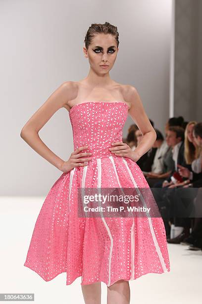 Model walks the runway at the House Of Evolution show at the Fashion Scout venue during London Fashion Week SS14 at Freemasons Hall on September 15,...