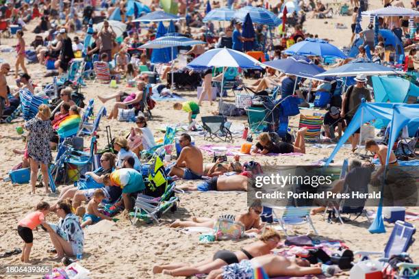 Beachgoers pack on to Old Orchard Beach on Saturday, September 2, 2023.