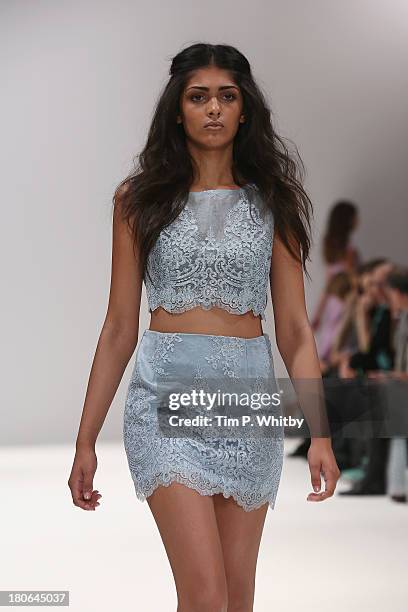 Model walks the runway at the House Of Evolution show at the Fashion Scout venue during London Fashion Week SS14 at Freemasons Hall on September 15,...