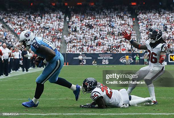 Delanie Walker of the Tennessee Titans scores a touchdown in the fourth quarter against the Houston Texans at Reliant Stadium on September 15, 2013...