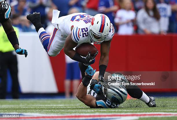 Fred Jackson of the Buffalo Bills is tackled during NFL game action by Luke Kuechly of the Carolina Panthers at Ralph Wilson Stadium on September 15,...