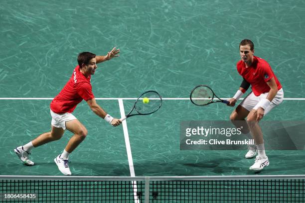 Alexis Galarneau of Canada plays a backhand with Vasek Pospisil of Canada during the Quarter Final match against Otto Virtanen and Harri Heliovaara...