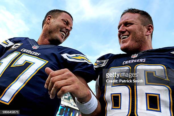 Quarterback Philip Rivers of the San Diego Chargers and teammate Jeromey Clary celebrate after defeating the Philadelphia Eagles at Lincoln Financial...