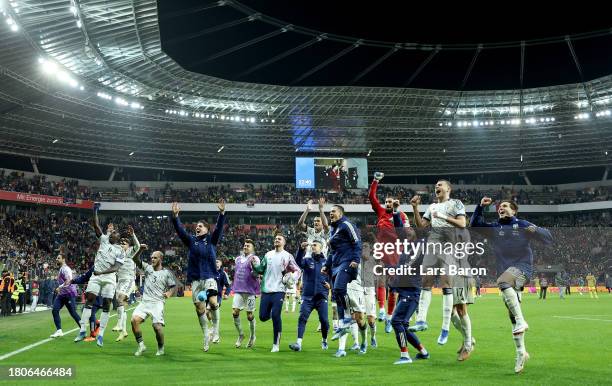 Players of Italy celebrate after the UEFA EURO 2024 European qualifier match between Ukraine and Italy at BayArena on November 20, 2023 in...