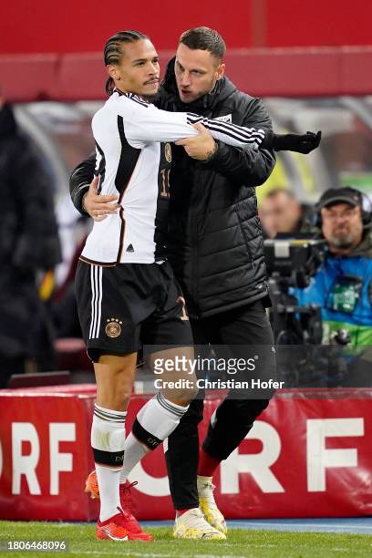 Leroy Sane of Germany is consoled by Marko Arnautovic of Austria after being shown a red card during the international friendly match between Austria...