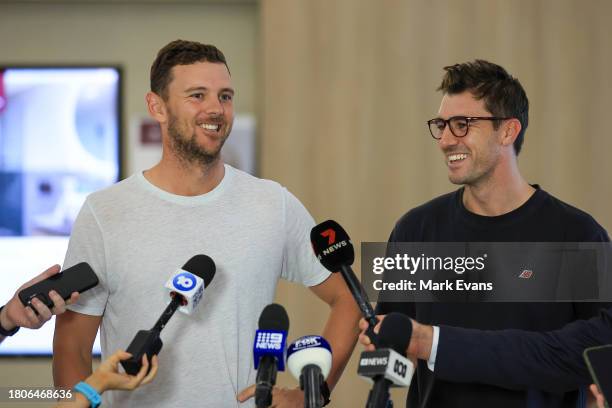 Australian cricketers Pat Cummins and Josh Hazlewood speak to the media on arrival at Sydney International Airport on November 22, 2023 in Sydney,...