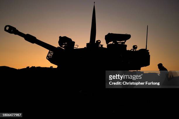 Israeli artillery train their guns towards the Gaza strip on November 21, 2023 in Southern Israel. More than a month after Hamas's Oct. 7 attacks,...