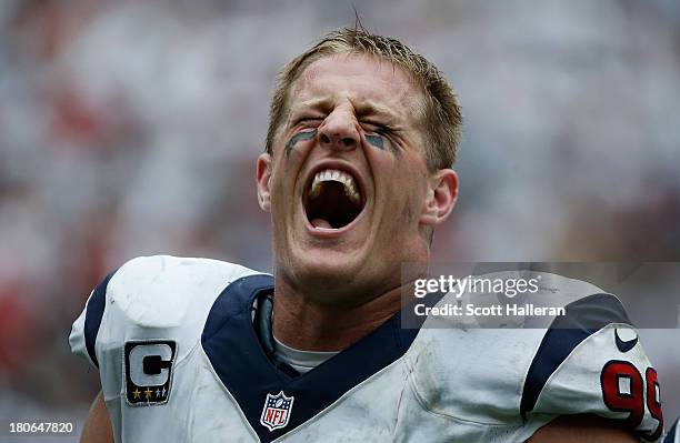 Watt of the Houston Texans screams towards the stands during the game against the Tennessee Titans at Reliant Stadium on September 15, 2013 in...