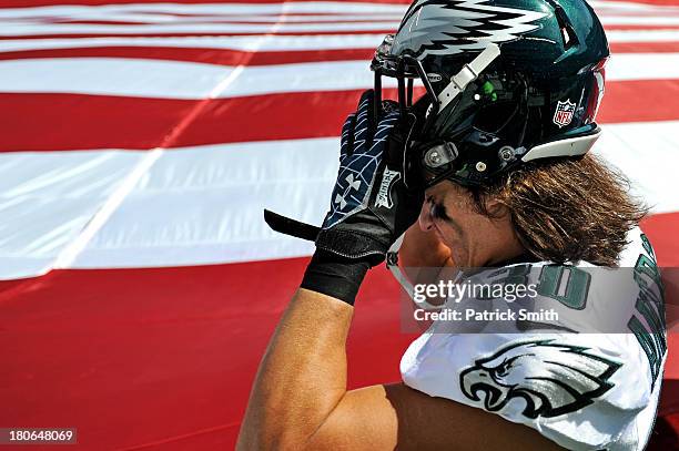 Safety Colt Anderson of the Philadelphia Eagles puts on his helmet before playing the San Diego Chargers at Lincoln Financial Field on September 15,...