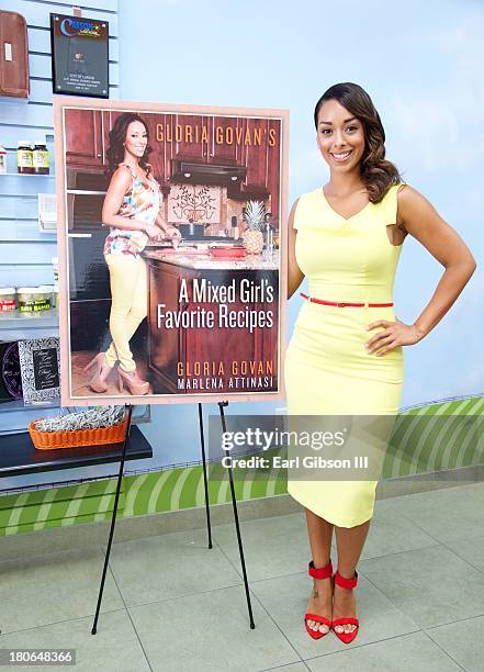 Basketball Wives star Gloria Govan poses for a photo at her book signing at Juice-C-Juice Books & More on September 15, 2013 in Carson, California.