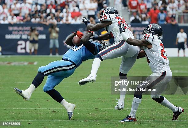 Kareem Jackson of the Houston Texans drops a hit in the second half on ;Kendall Wright of the Tennessee Titans at Reliant Stadium on September 15,...