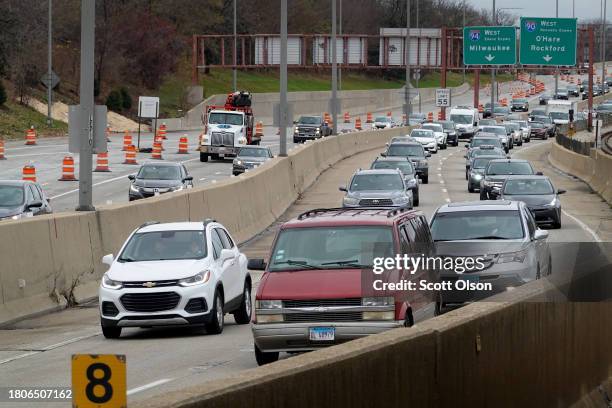 Cars sit in traffic on the Kennedy Expressway as Thanksgiving holiday travel heads into full swing on November 21, 2023 in Chicago, Illinois. AAA...