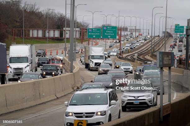 Cars sit in traffic on the Kennedy Expressway as Thanksgiving holiday travel heads into full swing on November 21, 2023 in Chicago, Illinois. AAA...