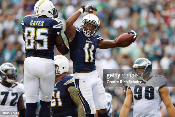 Wide receiver Eddie Royal of the San Diego Chargers celebrates with teammate Antonio Gates in the end zone after making a catch for a 15 yard...