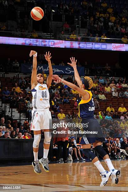 Iziane Castro Marques of the Connecticut Sun shoots against Layshia Clarendon of the Indiana Fever on September 15, 2013 at the Mohegan Sun in...