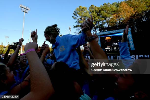 Head Coach Erin Matson of the North Carolina Tar Heels is lifted up by her team after defeating the Northwestern Wildcats for the national title...