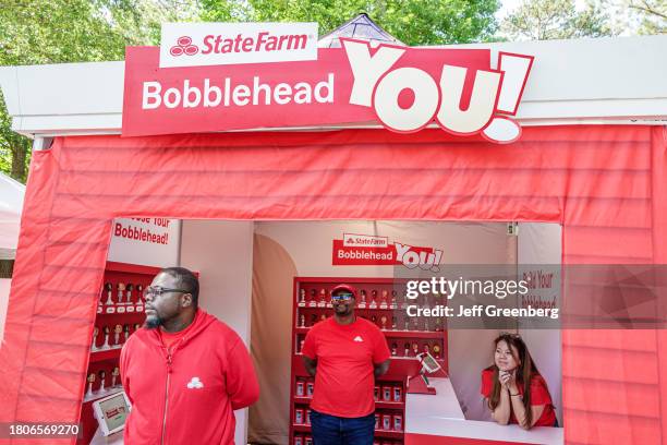 Alpharetta, Atlanta, Georgia, Alpharetta Arts Street fest, State Farm Insurance vendor stall, bobblehead figurines.