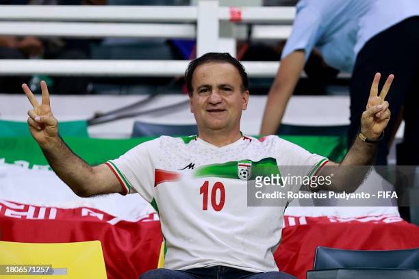 Iran player's parent supports the team during the FIFA U-17 World Cup Round of 16 match between Morocco and IR Iran at Gelora Bung Tomo Stadium on...
