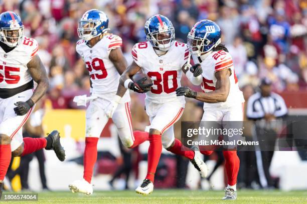 Darnay Holmes of the New York Giants celebrates with Deonte Banks of the New York Giants during an NFL football game between the Washington...