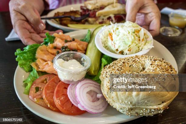 Atlanta, Georgia, The Battery Atlanta Truist Park stadium, Goldbergs deli food, bagel Nova salmon lox Cole slaw, sliced tomato.