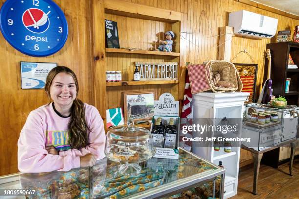 Nicholson, Georgia, Carole's Country Cupboard, employee at cashier counter, syrup relish jam display.