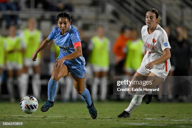 Nata Ramirez of the Columbia Lions dribbles against Mackenzie Duff of the Clemson Tigers in the first half during the second round of NCAA playoffs...