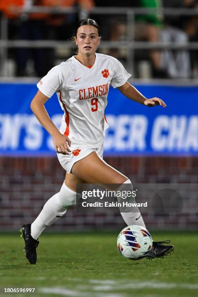 Mackenzie Duff of the Clemson Tigers dribbles against the Columbia Lions in the first half during the second round of NCAA playoffs at Historic Riggs...