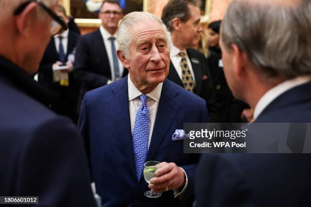 Britain's King Charles III meets guests as he hosts a Global Investment Summit Reception at Buckingham Palace on November 27, 2023 in London, England.