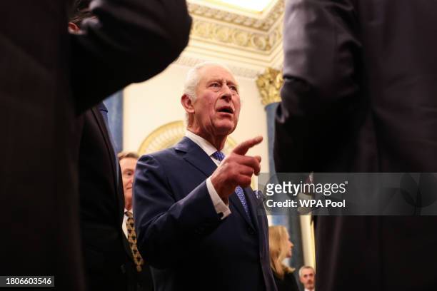 Britain's King Charles III meets guests as he hosts a Global Investment Summit reception at Buckingham Palace on November 27, 2023 in London, England.