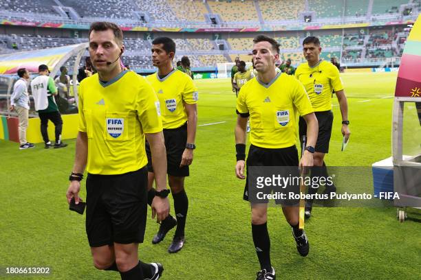 Referee Gustavo Tejera and Assistant Referees Carlos Barreiro, Ivo Nigel Mendez Chavez and Andres Nievas walk off the pitch after the FIFA U-17 World...