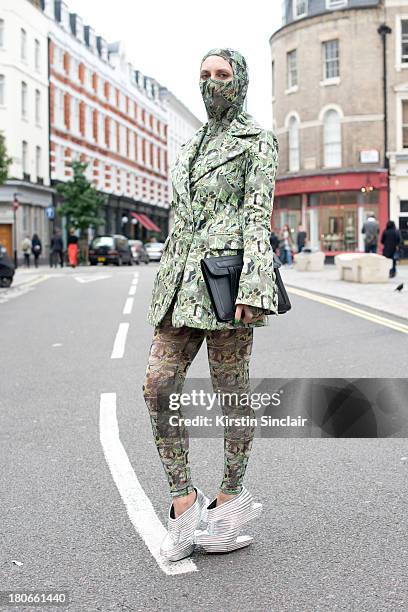 Ghost blogger Carmen Debeavoir wears Nude Republic shoes, Asos bag, leggings, top and jacket by Dans La Vie on day 3 of London Fashion Week...