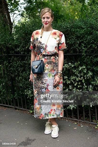 Lucky magazine digital director Verena Von Pfetten wears Converse trainers, Mother of Pearl dress, Vintage bag and Amrita Singh earrings on day 3 of...