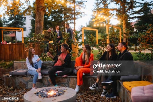 coworkers spending a casual team building evening - business party stockfoto's en -beelden
