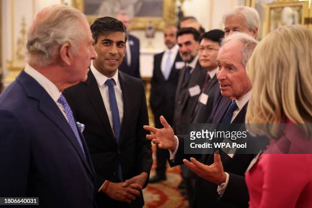 Britain's King Charles III and Britain's Prime Minister Rishi Sunak meet with CEO of Blackstone Stephen A. Schwarzman during a reception at...