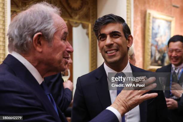 Britain's Prime Minister Rishi Sunak speaks with CEO of Blackstone Stephen A. Schwarzman during a reception at Buckingham Palace on November 27, 2023...