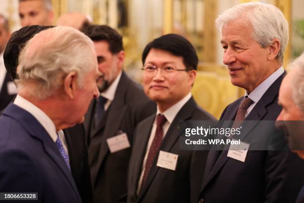 Britain's King Charles III speaks with CEO of JPMorgan Chase Jamie Dimon at a reception at Buckingham Palace to mark the conclusion of the Global...