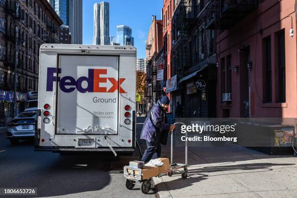 Driver for an independent contractor to FedEx delivers packages on Cyber Monday in New York, US, on Monday, Nov. 27, 2023. An estimated 182 million...