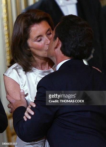 Nicolas Sarkozy kisses his wife Cecilia before being officially invested as France's president, 16 May 2007 at the Elysee Palace in Paris. Sarkozy, a...