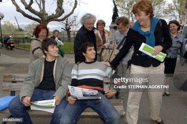 French ecologist party candidate for the 2007 upcoming presidential election, Dominique Voynet , shares a laugh with young people after giving...