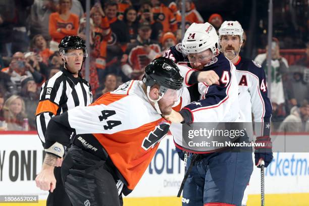 Nicolas Deslauriers of the Philadelphia Flyers and Mathieu Olivier of the Columbus Blue Jackets fight at the Wells Fargo Center on November 19, 2023...