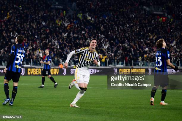 Dusan Vlahovic of Juventus FC celebrates after scoring the opening goal as Matteo Darmian , Henrikh Mkhitaryan and Nicolo Barella of FC...