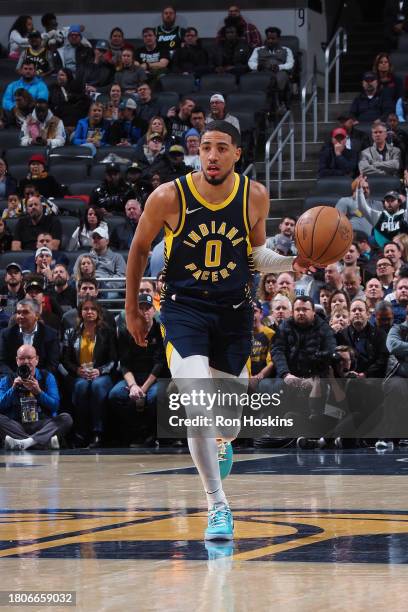 Tyrese Haliburton of the Indiana Pacers dribbles the ball during the game against the Portland Trail Blazers on November 27, 2023 at Gainbridge...