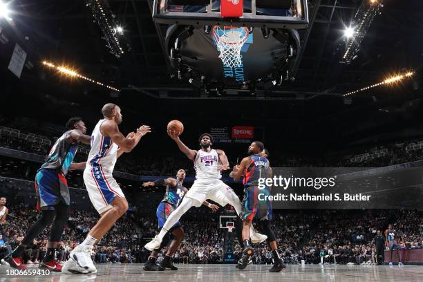 Joel Embiid of the Philadelphia 76ers drives to the basket during the game against the Brooklyn Nets on November 19, 2023 at Barclays Center in...