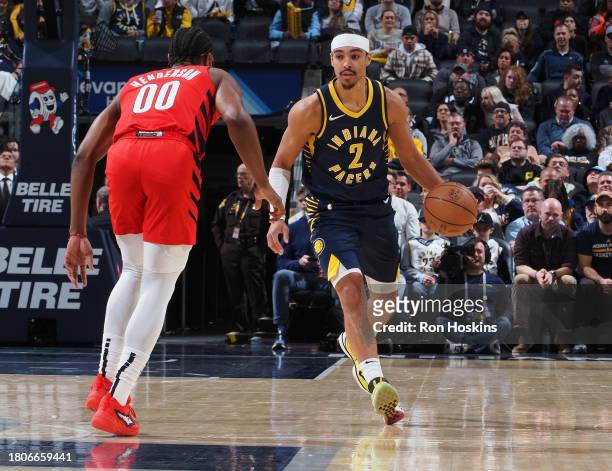 Andrew Nembhard of the Indiana Pacers handles the ball during the game against the Portland Trail Blazers on November 27, 2023 at Gainbridge...