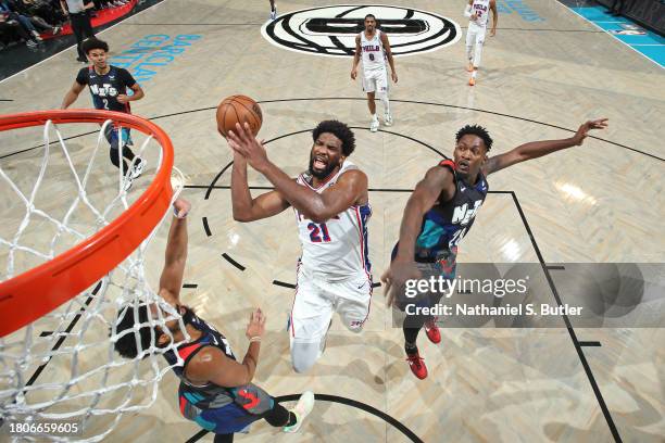 Joel Embiid of the Philadelphia 76ers drives to the basket during the game against the Brooklyn Nets on November 19, 2023 at Barclays Center in...