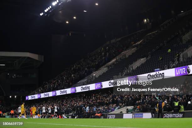 Check is shown on the advertising boards during the Premier League match between Fulham FC and Wolverhampton Wanderers at Craven Cottage on November...