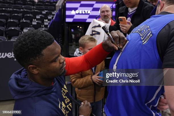 Zion Williamson of the New Orleans Pelicans signs autograph before the game against the Utah Jazz on November 27, 2023 at the Delta Center in Salt...