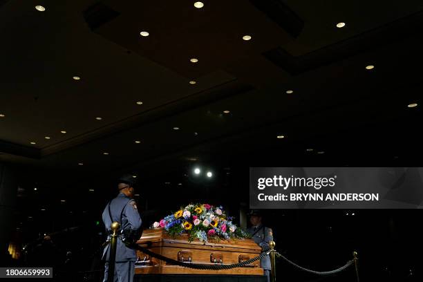 Georgia State Patrol honor guards stand as members of the public pay respects to former US First Lady Rosalynn Carter at the Carter Presidential...