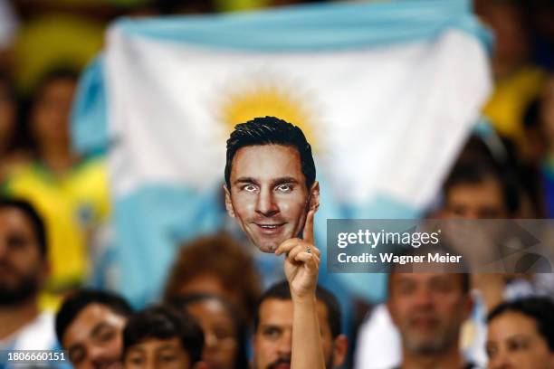 Fan holds a cardboard cut-out of Lionel Messi prior to a FIFA World Cup 2026 Qualifier match between Brazil and Argentina at Maracana Stadium on...